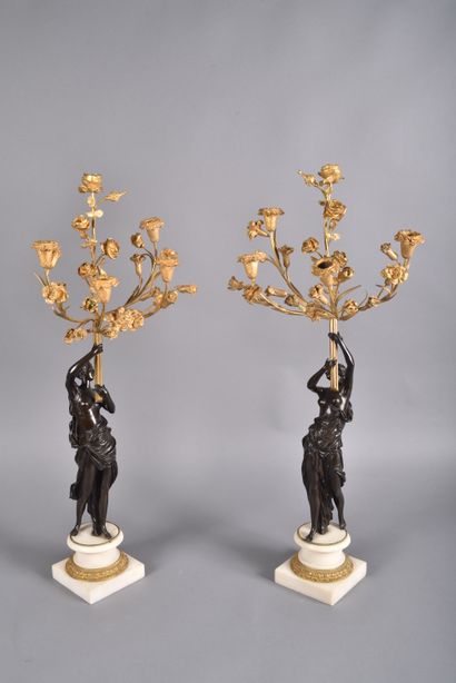 Pair of large candelabras in double patina...