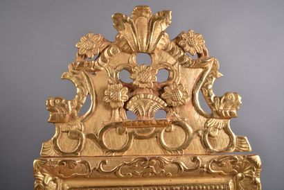 Gilded wood mirror decorated with lambrequins,...