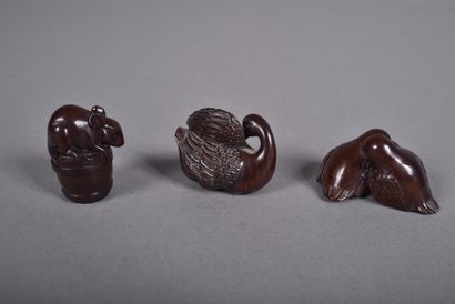 Set of three carved wood netsukes: 
- a pair...
