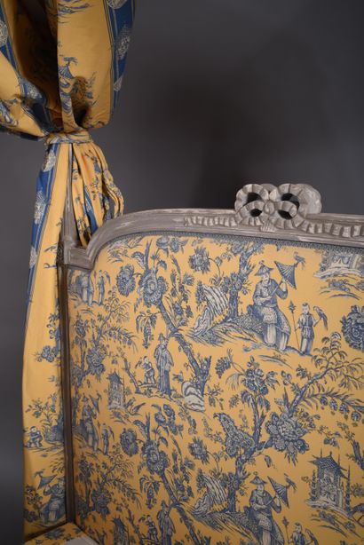 Polish-style bed in molded and carved wood...