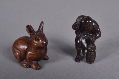 Set of two carved wooden netsukes, one depicting...