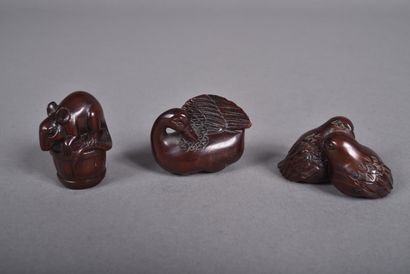 Set of three carved wood netsukes: 
- a pair...