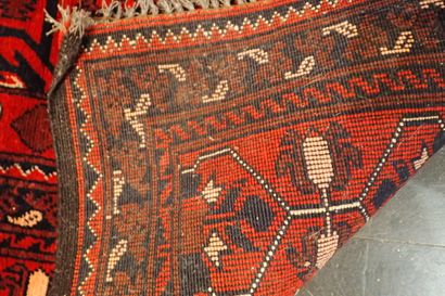 Handmade Oriental rug in red and navy blue...