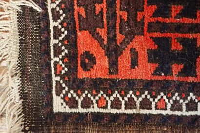 Oriental rug with geometric patterns in red...