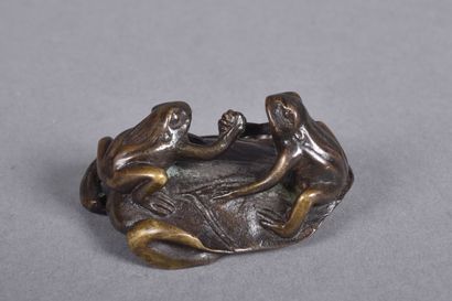 Small bronze paperweight with two frogs on...