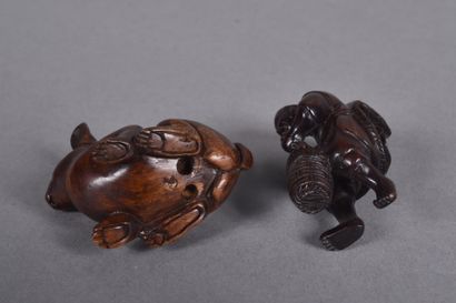 Set of two carved wooden netsukes, one depicting...