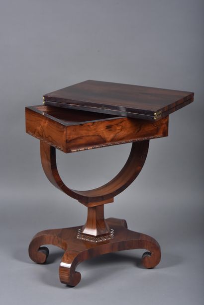 Wallet games table in rosewood veneer, revealing...