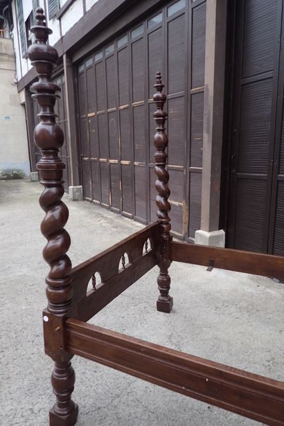 Moulded and carved rosewood bed resting on...