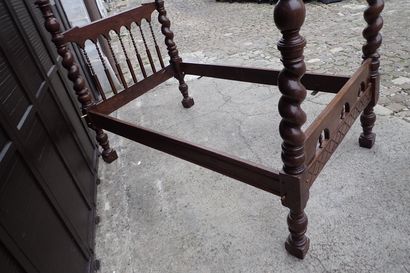 Moulded and carved rosewood bed resting on...