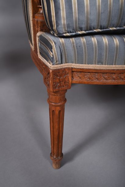 Pair of molded and carved beech bergères...
