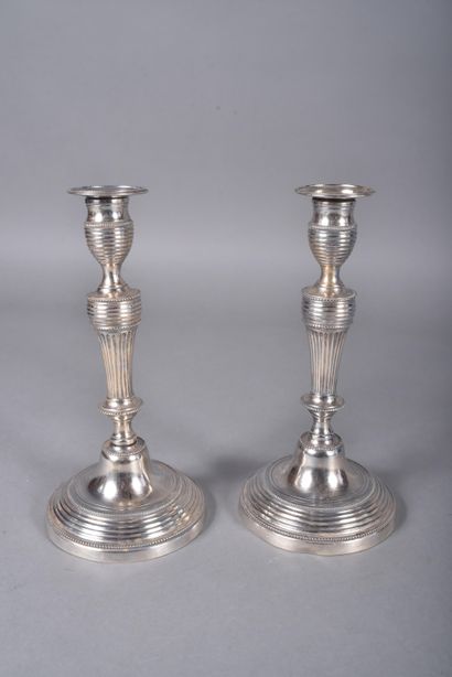 Pair of silver-plated candlesticks with tapered...