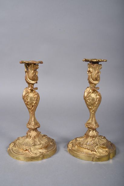 Pair of ormolu candlesticks in rocaille style,...