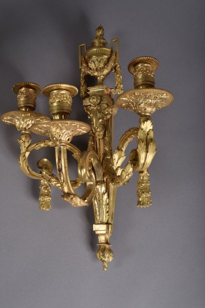 Pair of ormolu sconces with three scrolled...