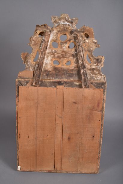 Gilded wood mirror decorated with lambrequins,...