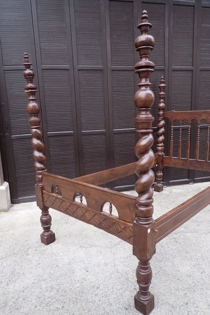 Moulded and carved rosewood bed resting on...