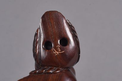 Set of three carved wood netsukes: 
- a pair...