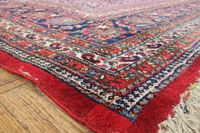 Very large oriental wool carpet in burgundy...