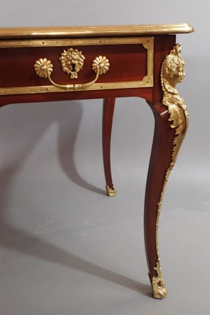 Mahogany and mahogany veneer flat desk, the...