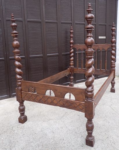 Moulded and carved rosewood bed resting on...