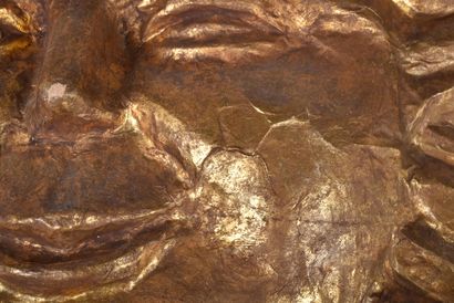 Large sun with smiling human face in gilded...