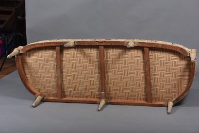 A large molded and carved beech sofa in cream,...