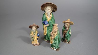 Ensemble de quatre statuettes en grès de...