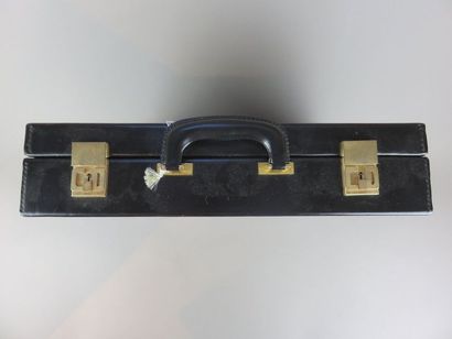 CHANEL Black leather card holder With its...