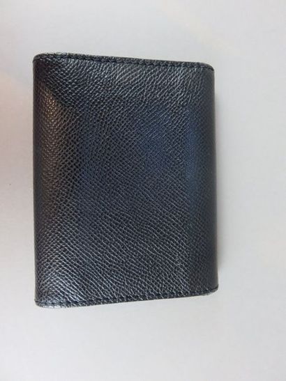 CHANEL Black leather card holder With its...