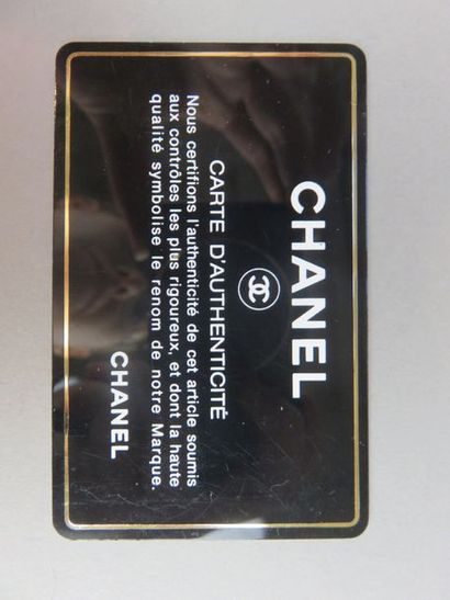 CHANEL Black leather card holder With its...