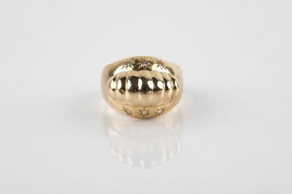 Yellow gold ring adorned with a gadrooned...