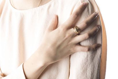 Yellow gold ring adorned with a gadrooned...