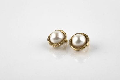 Pair of clip earrings adorned in the center...