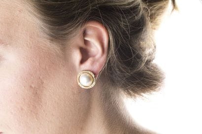 Pair of clip earrings adorned in the center...