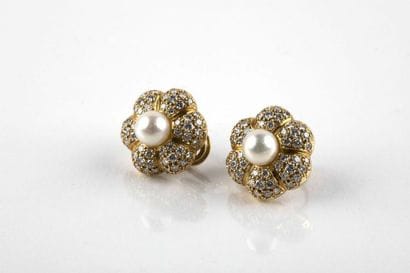 Pair of floral shaped clip earrings, decorated...