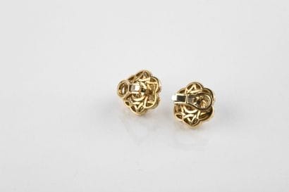 Pair of floral shaped clip earrings, decorated...