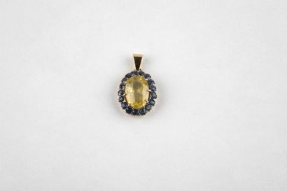 Yellow gold pendant, adorned in the center...
