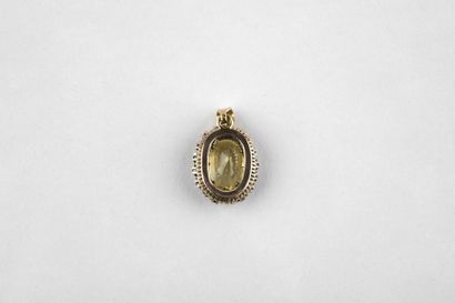 Yellow gold pendant, adorned in the center...