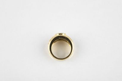 Yellow gold rush ring adorned in the center...