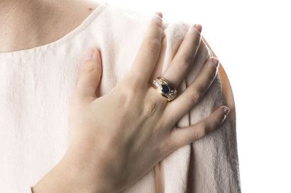 Yellow gold rush ring adorned in the center...