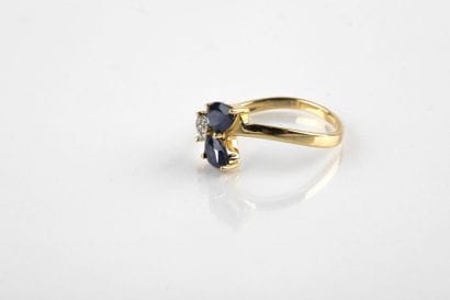 Yellow gold ring adorned with two pear-shaped...