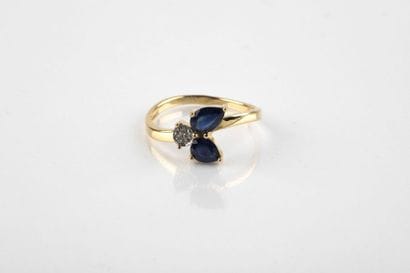 Yellow gold ring adorned with two pear-shaped...