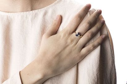 Yellow gold ring adorned with two pear-shaped...