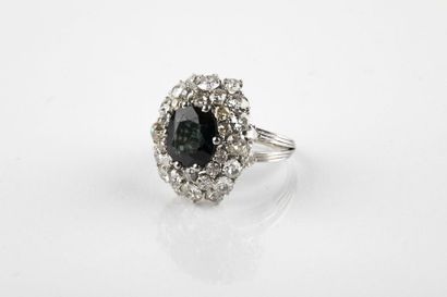 Platinum flower ring adorned in the center...