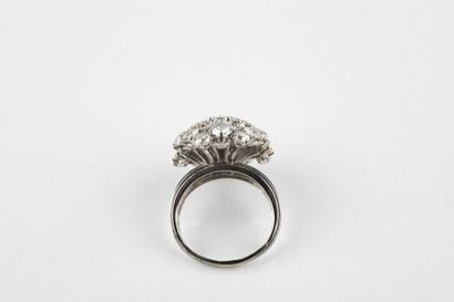 Platinum flower ring adorned in the center...