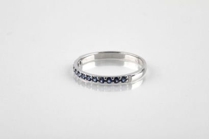 Half wedding ring in white gold set with...