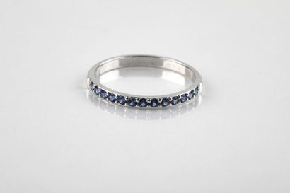 Half wedding ring in white gold set with...