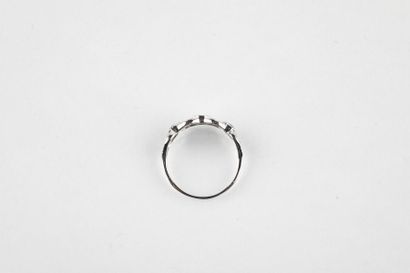 White gold ring set with three oval cut sapphires...