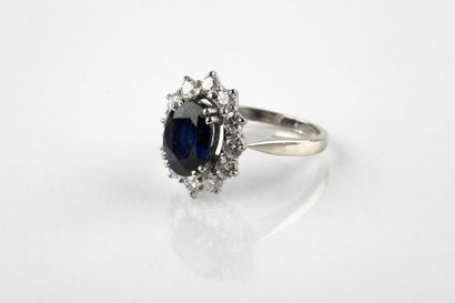 White gold daisy ring, adorned in the center...