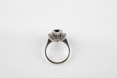White gold daisy ring, adorned in the center...