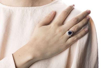White gold daisy ring, adorned in the center...